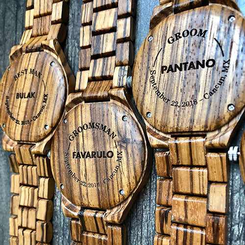 Custom wooden watches featuring intricate engravings, showcasing unique designs and craftsmanship.
