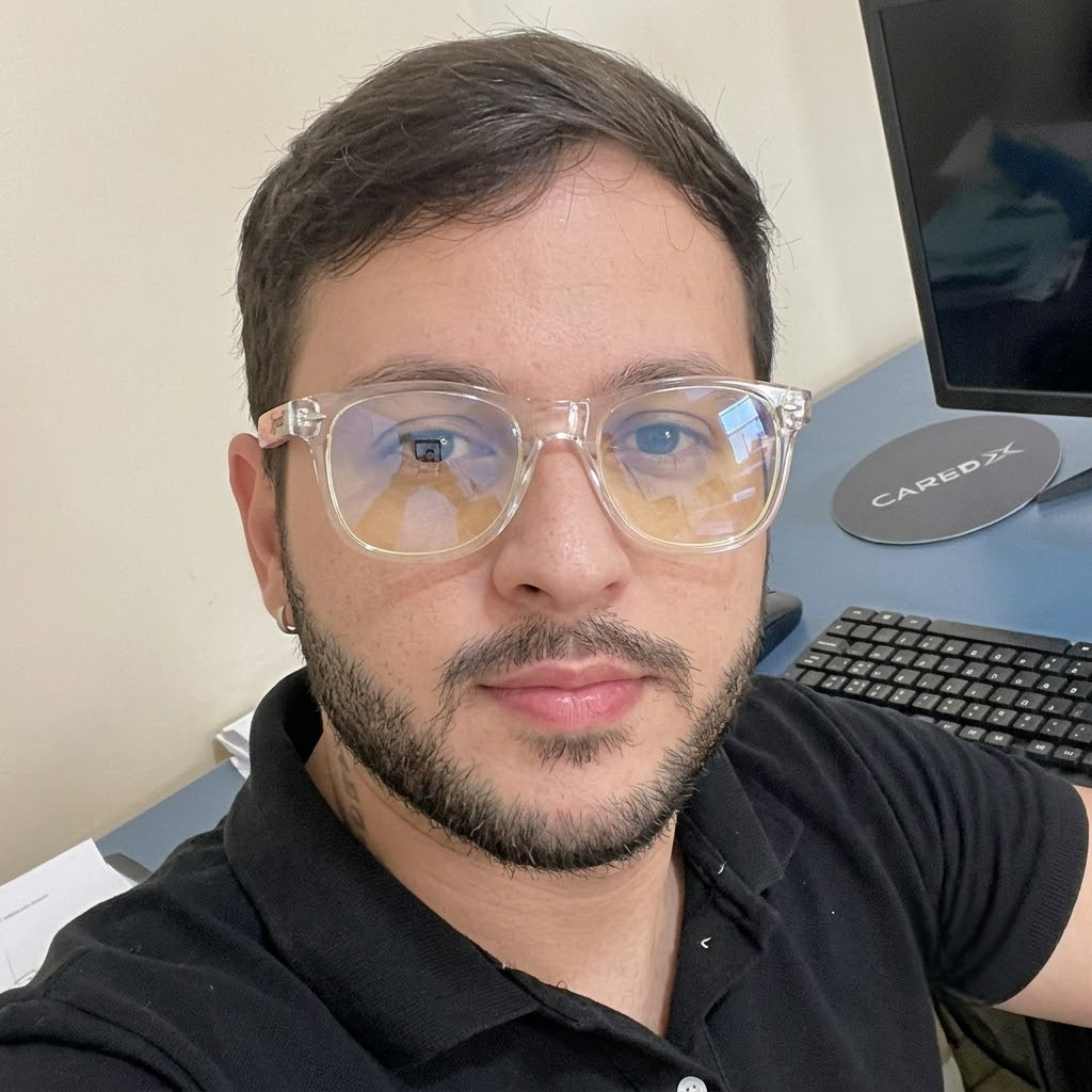 Blue light blocking glasses on a person, clear frame with tinted lenses