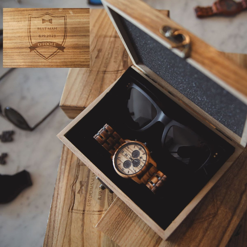 Wooden gift box with watch and sunglasses set, open lid showing accessories