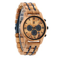 Wooden chronograph watch with round tan dial, blue accent straps, black bezel, three subdials