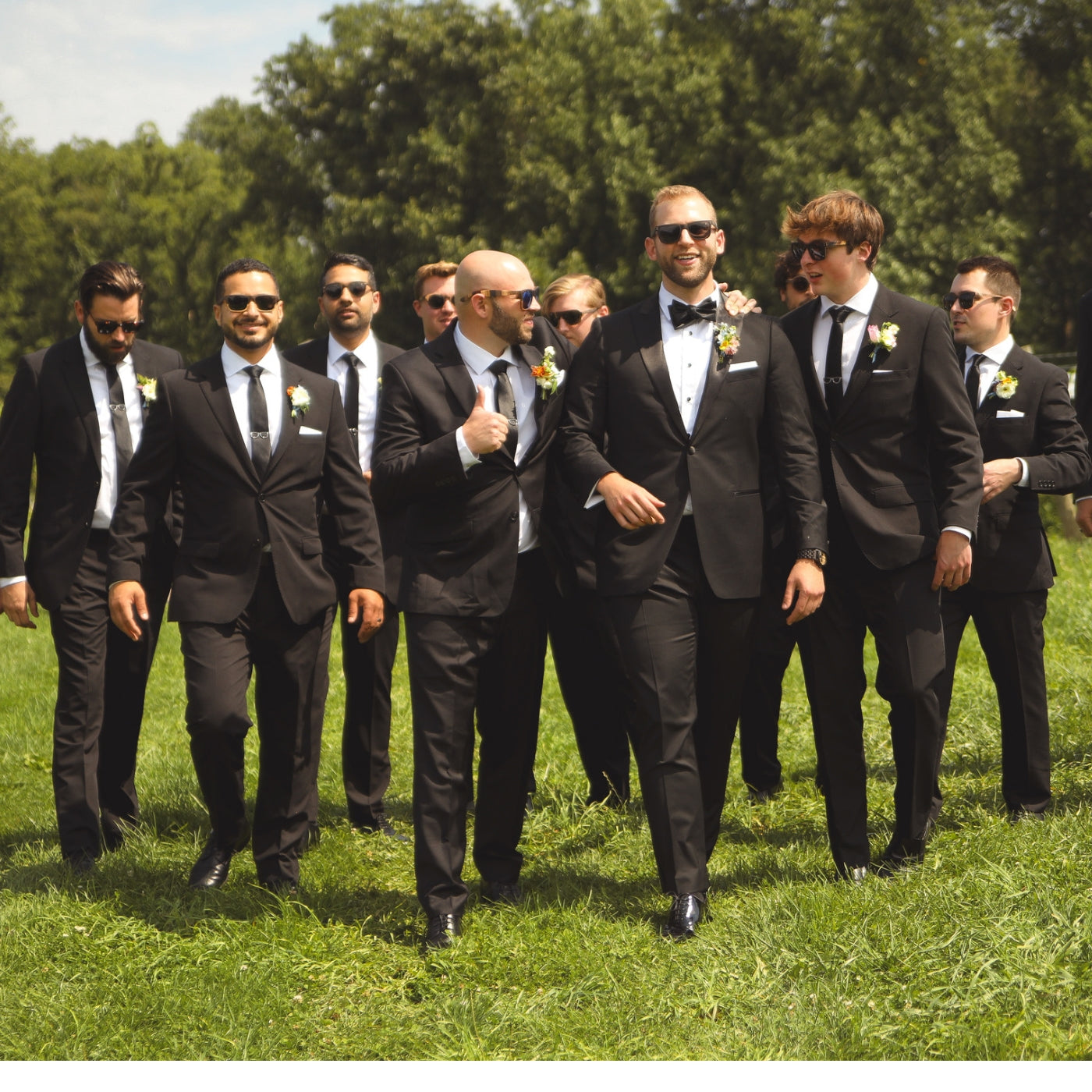 A group of men in black suits walking together, exuding professionalism and camaraderie.
