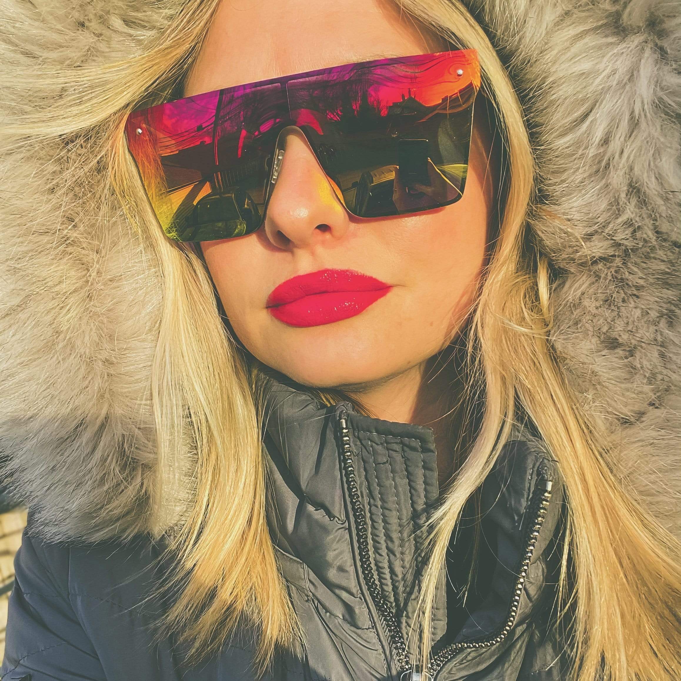Rectangular sunglasses with colorful reflective lenses and black frame