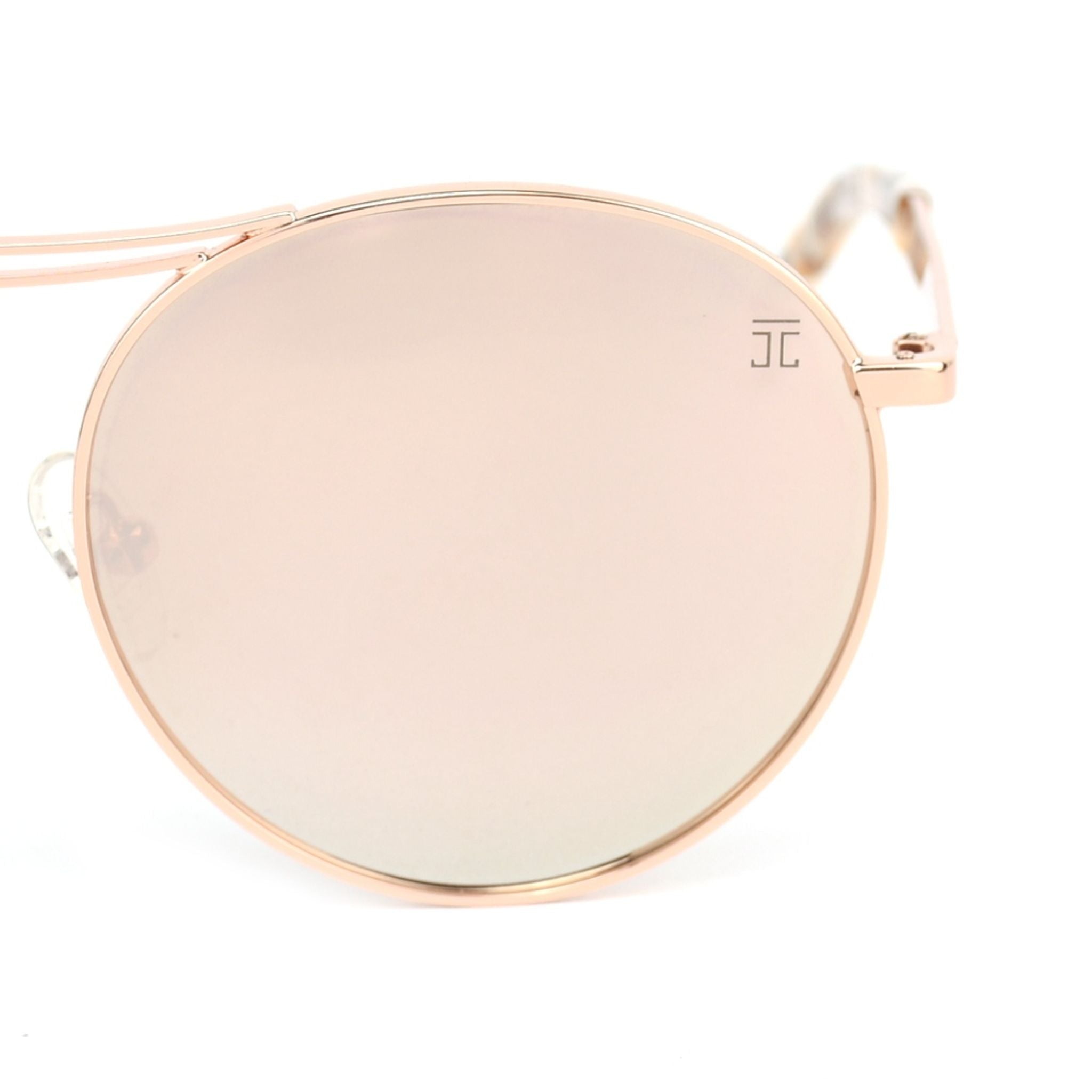 Cat-eye sunglasses close-up with pink round lenses and pink metal frame