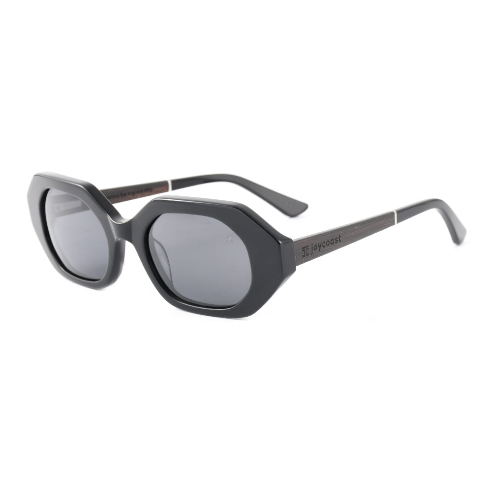 Women’s sunglasses with black acetate frame and grey tinted lenses, oval shape