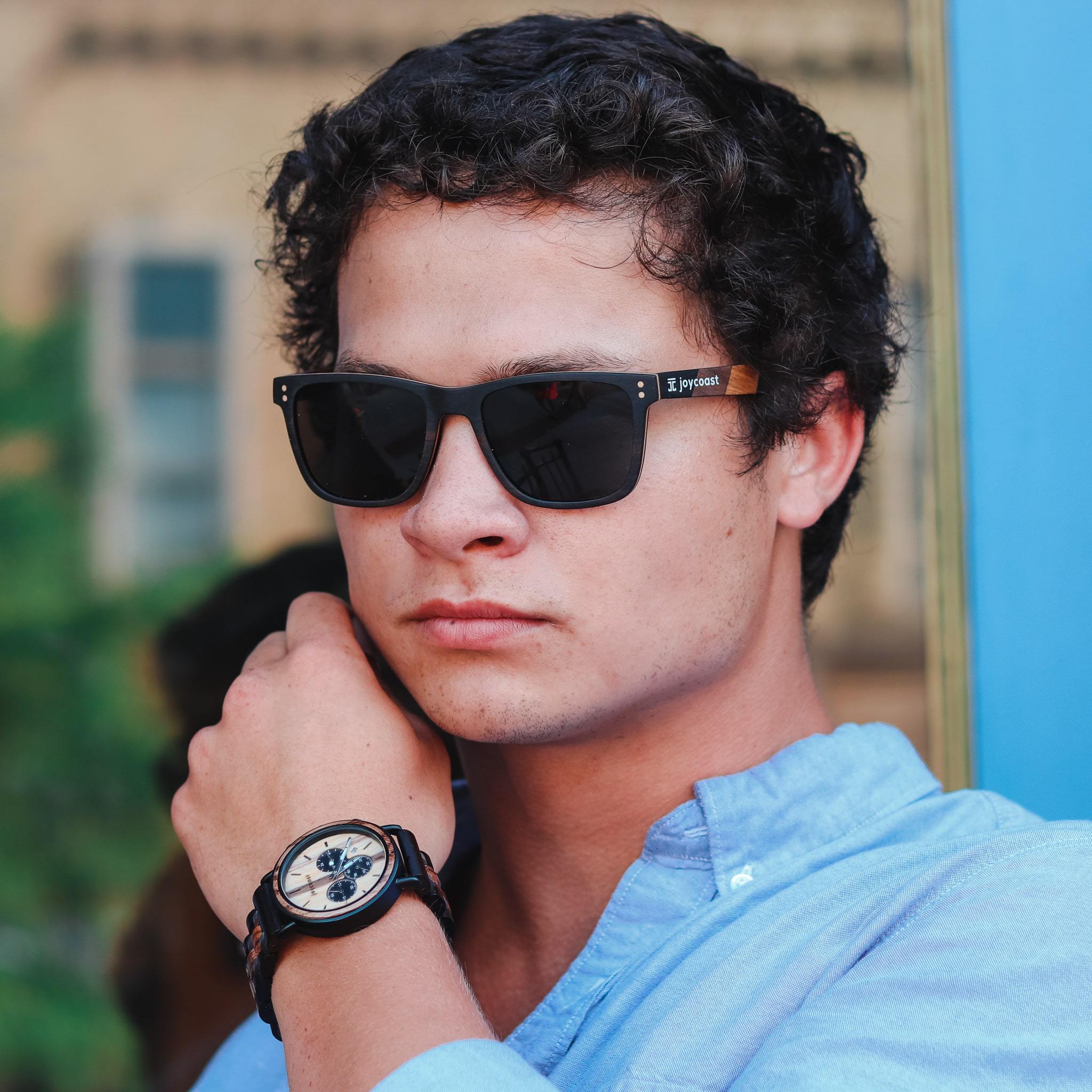 Dark-framed sunglasses with zebrawood arms and black lenses