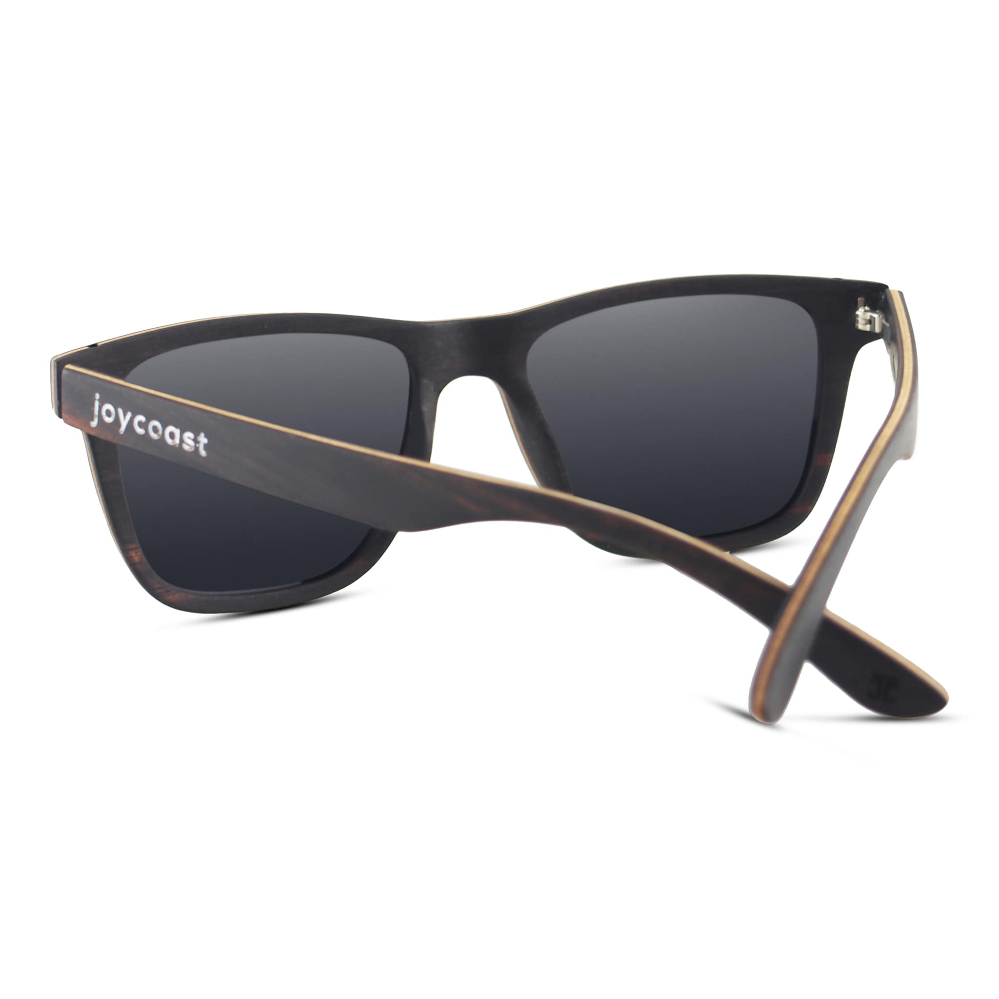 Dark sunglasses with black lenses, joycoast logo on arm, and gold accents